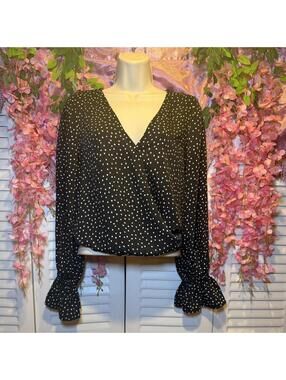 The drop Black and white polka dot blouse with ruffle sleeves #polkadot